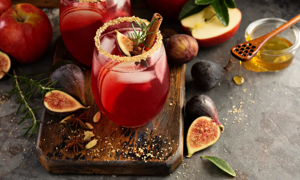A red cocktail with seasonal fruit 